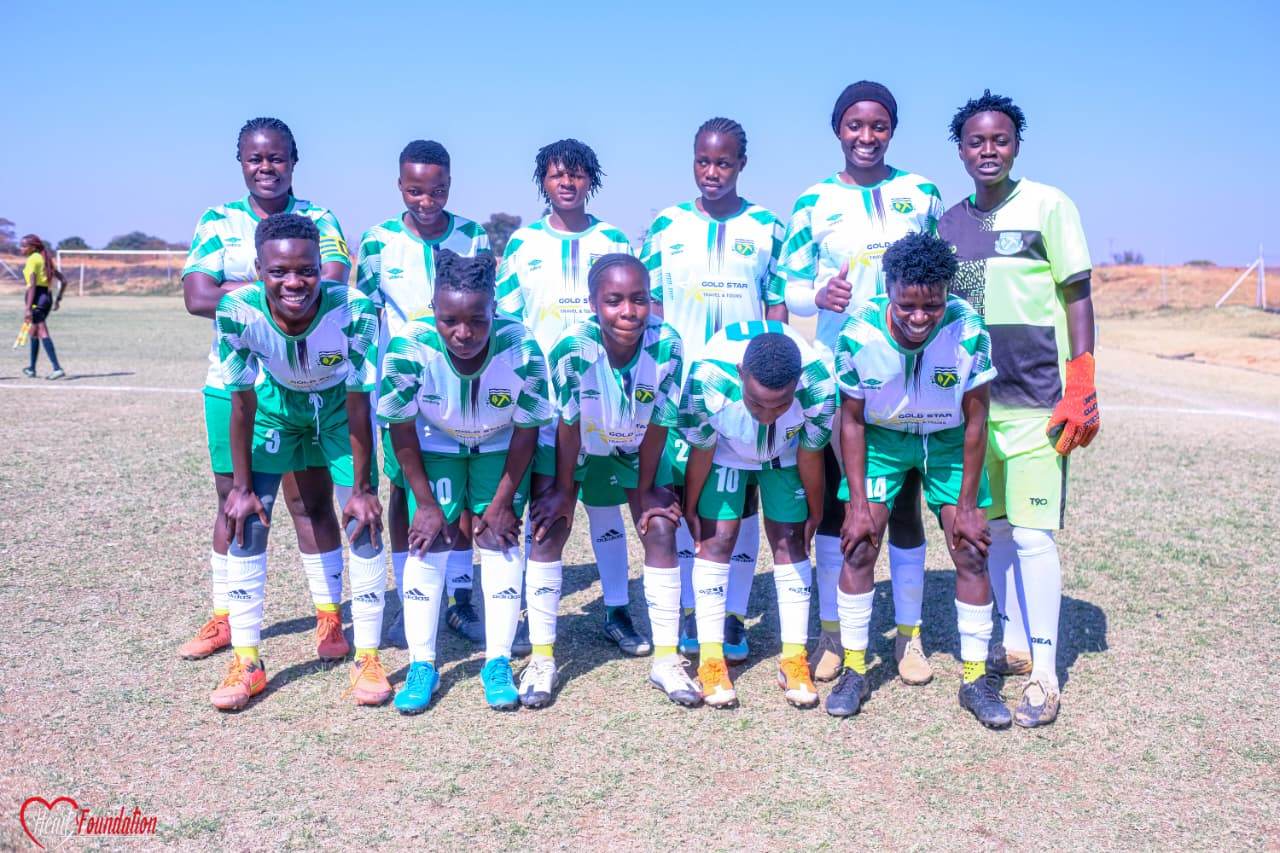 The women's starting eleven posed in green and white kit before kick-off